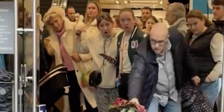 Man is klaar met klimaatactiviste en grijpt zelf in bij uitgang Primark